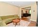 Living room featuring a comfortable sofa and a view into an adjacent room with a desk at 5456 Reston Dr, Plainfield, IN 46168