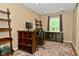Office space with desk, office chair and view of the landscaped yard outside at 5456 Reston Dr, Plainfield, IN 46168