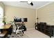 This home office offers a comfortable workstation with a monitor and natural light from a window at 5456 Reston Dr, Plainfield, IN 46168