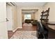 Office with a desk overlooking a living room and stylish sliding barn door at 5456 Reston Dr, Plainfield, IN 46168