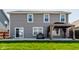The backyard features a new patio with a gazebo, lush grass, and privacy fence at 5794 Cherrywood Ln, McCordsville, IN 46055