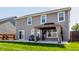 The backyard features a new patio with a gazebo, lush grass, and privacy fence at 5794 Cherrywood Ln, McCordsville, IN 46055