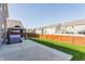 The backyard features a new patio with a gazebo, lush grass, and privacy fence at 5794 Cherrywood Ln, McCordsville, IN 46055