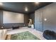 Finished basement with a large screen, vintage arcade game, and neutral carpet at 5794 Cherrywood Ln, McCordsville, IN 46055