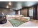 Finished basement featuring a large sectional couch, projector, and recessed lighting at 5794 Cherrywood Ln, McCordsville, IN 46055