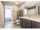 Bathroom featuring modern sink with vanity storage and a combined shower and bathtub at 5794 Cherrywood Ln, McCordsville, IN 46055