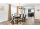 Charming dining room with modern lighting and a stylish rug complements the dark wood table at 5794 Cherrywood Ln, McCordsville, IN 46055