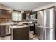 Well-lit kitchen featuring stainless steel appliances, ample counter space, and modern finishes at 5794 Cherrywood Ln, McCordsville, IN 46055