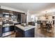 Modern kitchen with stainless steel appliances open to the dining and living areas at 5794 Cherrywood Ln, McCordsville, IN 46055