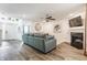 Inviting living room with a fireplace, a comfortable sofa, and stylish decor at 5794 Cherrywood Ln, McCordsville, IN 46055