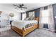 Spacious main bedroom with a fireplace, ceiling fan and large windows for natural light at 5794 Cherrywood Ln, McCordsville, IN 46055