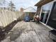 This backyard has a concrete patio, wood fence, and outdoor furniture at 5941 Deerwood Ct, Indianapolis, IN 46254