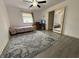 Bright bedroom featuring a window, desk, closet, and mirror at 5941 Deerwood Ct, Indianapolis, IN 46254