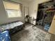 Bright bedroom featuring a window, desk, closet, and mirror at 5941 Deerwood Ct, Indianapolis, IN 46254