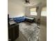 Cozy bedroom with two beds, a window with blinds, and a ceiling fan at 5941 Deerwood Ct, Indianapolis, IN 46254