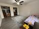 This bedroom features a ceiling fan, a rug, 2 closets, and a bed at 5941 Deerwood Ct, Indianapolis, IN 46254