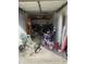 This garage is full of bicycles, chairs, and equipment at 5941 Deerwood Ct, Indianapolis, IN 46254