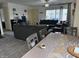 An open-concept living room and dining area with lots of seating and natural light at 5941 Deerwood Ct, Indianapolis, IN 46254