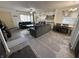 The living room features an open layout with a fireplace and blends into a dining area with neutral décor at 5941 Deerwood Ct, Indianapolis, IN 46254