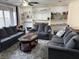Comfortable living room with plush seating, a ceiling fan, and built-in shelving, creating an inviting atmosphere at 5941 Deerwood Ct, Indianapolis, IN 46254