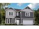 Two-story home with gray siding, white trim, and a two-car garage at 600 Bluestem Ln, New Whiteland, IN 46184