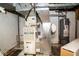 Basement with water heater, furnace, duct work, and some storage space at 6180 Winnpeny Ln, Indianapolis, IN 46220
