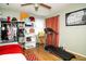 Comfortable bedroom features decor, a closet for clothes, a treadmill, and wood floors providing space at 6180 Winnpeny Ln, Indianapolis, IN 46220