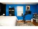 This stylish bedroom boasts colorful walls, a window, and a designated workout area with exercise equipment at 6180 Winnpeny Ln, Indianapolis, IN 46220