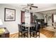 A view of the Dining area featuring a round glass table, seating for four, and hardwood floors at 6180 Winnpeny Ln, Indianapolis, IN 46220