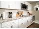 Close up on the kitchen featuring white cabinets, granite countertops, and stainless steel appliances at 6180 Winnpeny Ln, Indianapolis, IN 46220