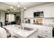 Bright kitchen featuring white cabinets, granite countertops, and stainless steel appliances at 6180 Winnpeny Ln, Indianapolis, IN 46220