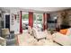 Bright living room with hardwood floors, large windows and an elegant fireplace at 6180 Winnpeny Ln, Indianapolis, IN 46220