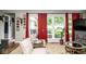 Comfortable living room with natural light, wood floors and a view of the outdoors at 6180 Winnpeny Ln, Indianapolis, IN 46220