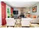 Cozy living area features a stone fireplace and comfortable seating at 6180 Winnpeny Ln, Indianapolis, IN 46220