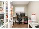 Office room featuring a desk, computer, storage, and hardwood floors at 6180 Winnpeny Ln, Indianapolis, IN 46220