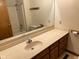 Bathroom with an extended vanity and mirror, featuring a tub and shower at 641 S Grant St, Brownsburg, IN 46112