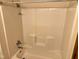 Clean one-piece bathtub and shower unit in neutral tones at 641 S Grant St, Brownsburg, IN 46112