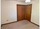 Bedroom features neutral carpet, ceiling fan, and a closet at 641 S Grant St, Brownsburg, IN 46112