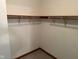Walk-in closet with shelving and rod, providing organized storage at 641 S Grant St, Brownsburg, IN 46112