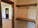 Walk-in closet with shelving and rod, providing organized storage at 641 S Grant St, Brownsburg, IN 46112