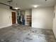 Well-lit garage with built-in shelving, water heater, and ample space for storage at 641 S Grant St, Brownsburg, IN 46112