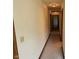 Neutral hallway featuring carpet and access to various rooms at 641 S Grant St, Brownsburg, IN 46112