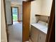 Functional laundry room with washer and dryer hookups adjacent to the entry at 641 S Grant St, Brownsburg, IN 46112