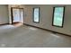 Bright living room features neutral carpet, ample natural light, and a welcoming entrance at 641 S Grant St, Brownsburg, IN 46112