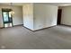 Spacious living room with neutral carpet and ample natural light at 641 S Grant St, Brownsburg, IN 46112