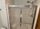 Enclosed shower with sliding glass door, and chrome fixtures at 641 S Grant St, Brownsburg, IN 46112