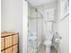 Bright bathroom featuring a glass-enclosed shower with a built-in seat and safety bars at 655 N Sobota Way, Trafalgar, IN 46181