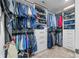 Organized walk-in closet with custom shelving, hanging rods, and drawers for optimal storage space at 655 N Sobota Way, Trafalgar, IN 46181