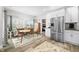 Sunny eat in kitchen with an adjacent dining area and a stainless steel refrigerator at 655 N Sobota Way, Trafalgar, IN 46181