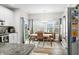 Bright eat in kitchen with an adjacent dining area and stainless steel refrigerator at 655 N Sobota Way, Trafalgar, IN 46181